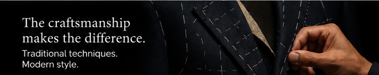 Hand holding a basted jacket with visible stitching